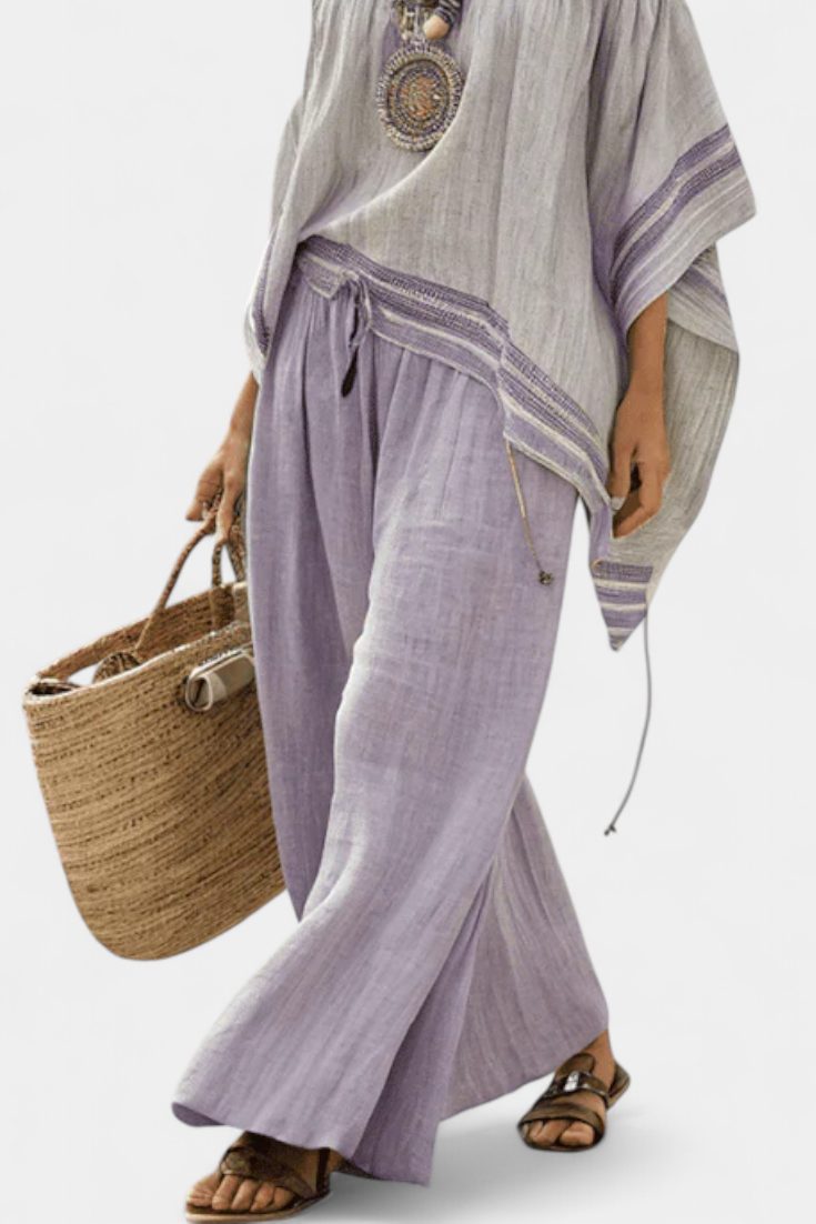 Zandrel | Top elegante con hombros descubiertos y pantalón de rayas de pierna ancha