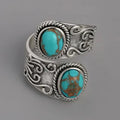 Elegante anillo de banda vintage con cruz y turquesa