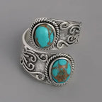 Elegante anillo de banda vintage con cruz y turquesa