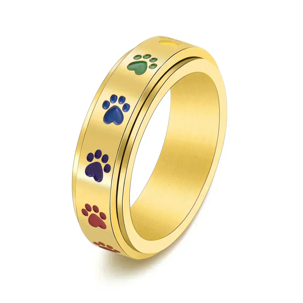 Thea - Anillo antiestrés giratorio con huellas de colores