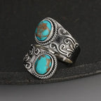 Elegante anillo de banda vintage con cruz y turquesa