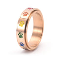 Thea - Anillo antiestrés giratorio con huellas de colores